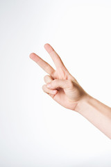 Hand showing the sign of victory and peace