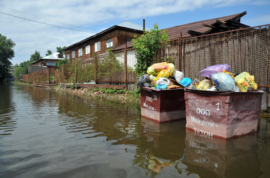 Containers with garbage in time flood.