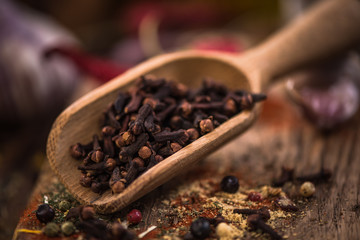 Cloves on wooden spoon,Christmas spices