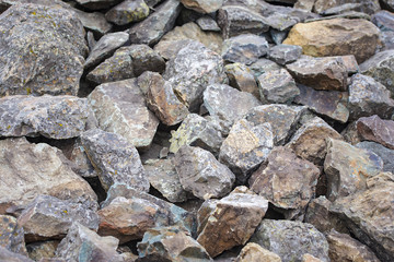 Heap of stones in the wild nature, background