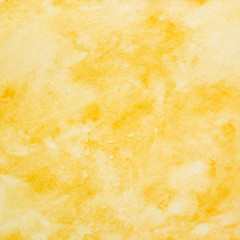 Yellow abstract watercolor painting textured on white paper background