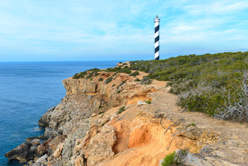 Moscarter lighthouse at the north coast of Ibiza island, Spain