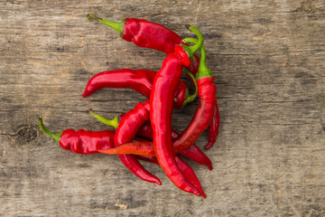 Red hot chili peppers on wooden table