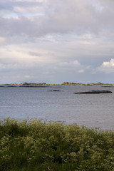 Panorama with midnight sun at Eggum at Lofoten in Norway