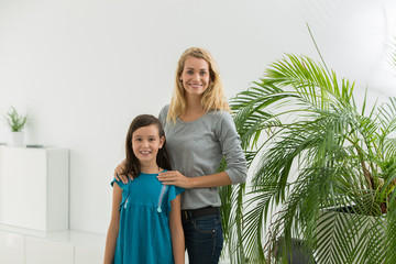 nanny and young girl in nice appartment