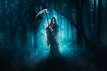 Fototapeta na wymiar grim reaper lurking in the woods / high contrast image