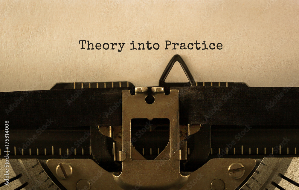 Fototapete text theory into practice typed on retro typewriter