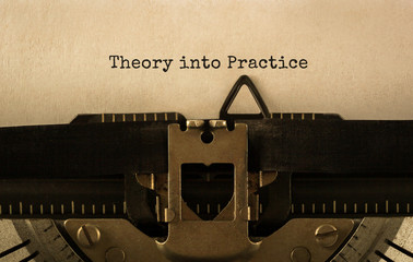 Text Theory into Practice typed on retro typewriter