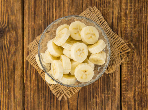 Portion of Sliced Bananas on wooden background, selective focus