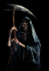 grim reaper with scytheisolated on black / high contrast image - obrazy, fototapety, plakaty