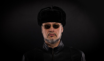 Obraz premium studio portrait of a man in a black winter hat