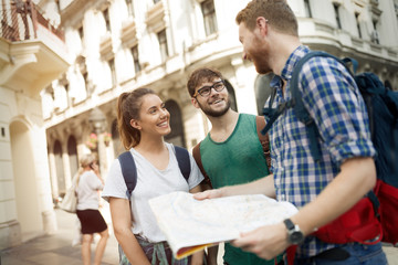 Happy group of tourists traveling and sightseeing