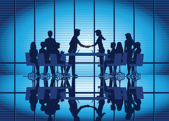 Silhouettes of Business partnership handshake.