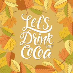 Let's drink hot cocoa! Falling leaves and wooden background.