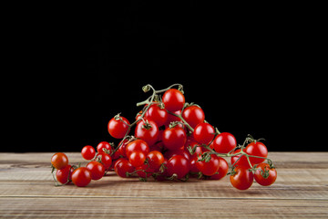 tomatoes on a black background closeup