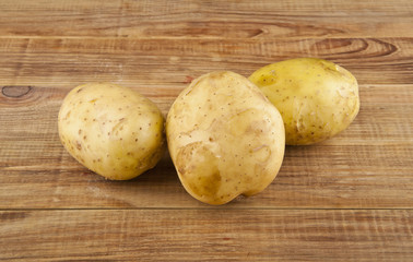 potatoes on a wooden table close-up