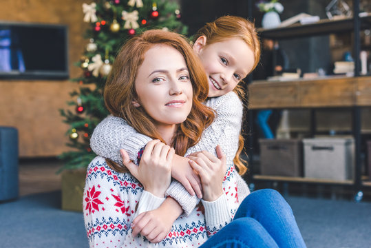 Mother And Daughter Embracing On Christmas