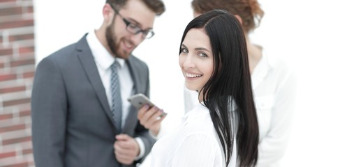 close-up of a beautiful woman manager and co-workers in the office