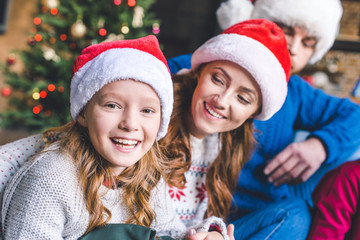 mother and daughter in santa hats