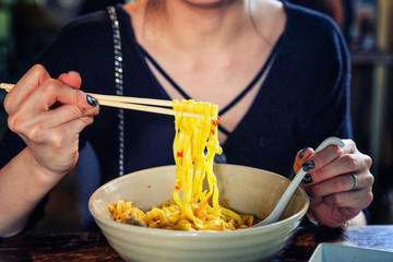 Northern Thai curried noodle soup with chicken meat and spicy coconut milk (Khao Soi Kai)
