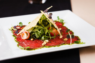 Beef carpaccio with salad
