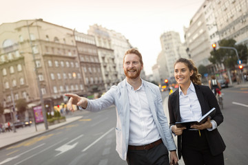 Businesspeople commuting and walking in city