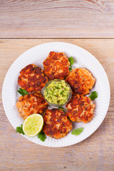 Salmon burgers with avocado salsa. Salmon cakes