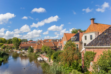 Old houses and river in the village of Winsum