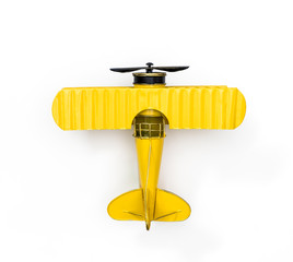 Yellow Metal toy plane isolated on white