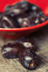 Dates on wooden background