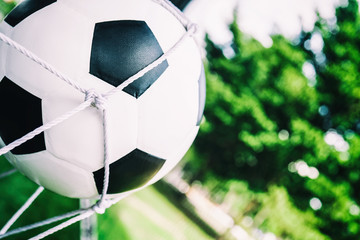 soccer ball in white net.
