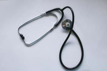 Black medical stethoscope isolated on white background