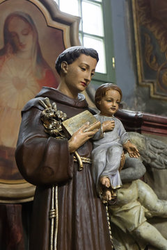 Saint Anthony of Padua holding baby Jesus statue with lily flower, church in Wroclaw Stock Photo | Adobe Stock Saint Anthony of Padua holding baby Jesus statue with lily flower, church in Wroclaw Stock Photo | Adobe Stock