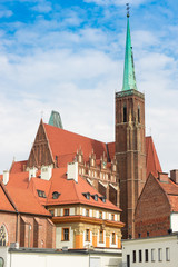 Fototapeta premium Wroclaw, view of Ostrow Tumski island, Church of the Holy Cross and St. Bartholomew, Poland
