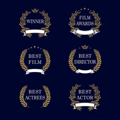 Naklejka premium Best film award golden laurel emblem. Film awards and best nominee gold award wreaths on dark blue background. Isolated vintage winner elegant vector logo