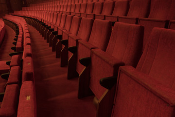 Rows with red chairs in a theater