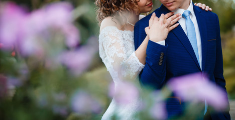 Bride and groom at wedding day walking outdoors on spring nature bridal couple happy newlywed