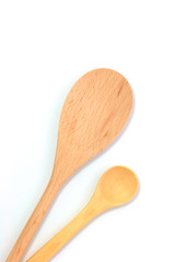 Simple wooden spoons on white background with copy space