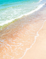 White bubble of Sea wave on the beach
