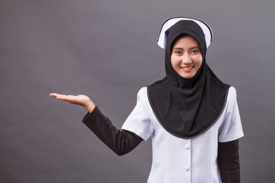 Muslim Nurse Pointing Up Hand