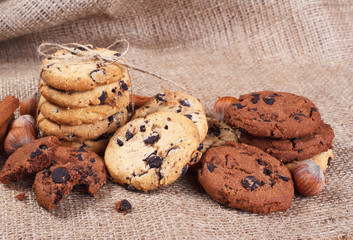 Delicious cookie with chocolate, cinnamon and nut lying on the table in the home.