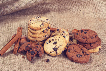 Delicious cookie with chocolate, cinnamon and nut lying on the table in the home.
