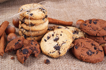 Delicious cookie with chocolate, cinnamon and nut lying on the table in the home.
