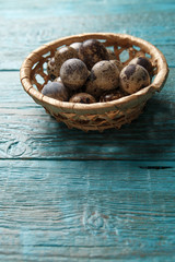 Photo of blue surface with quail eggs