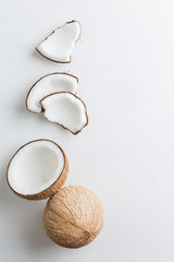 Tropical fruit whole and half abstract background .Coconut on white background. from top view