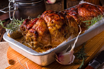 small Rolling roasts fully with dried fruit and bacon