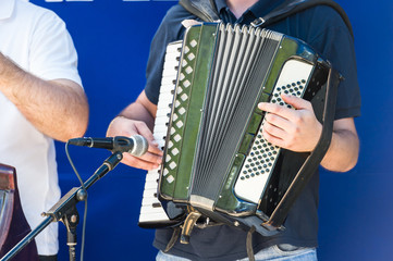 man hand on accordion