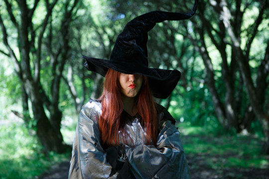 Image of dissatisfied witch in long black hat