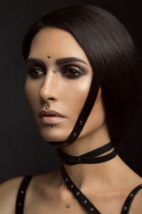 Young sexy brunette woman with piercings