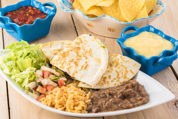 Spinach mushroom quesadillas with refried beans and rice.